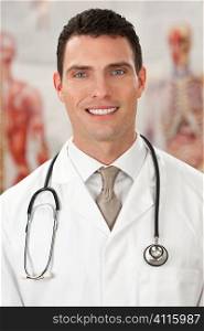 A male doctor with medical charts out of focus behind him.