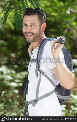 a male hiker is smiling