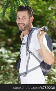 a male hiker is smiling