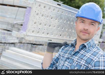 a male worker and stainless frame worker