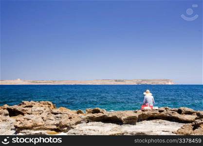 A maltese fisherman fishing in the sea