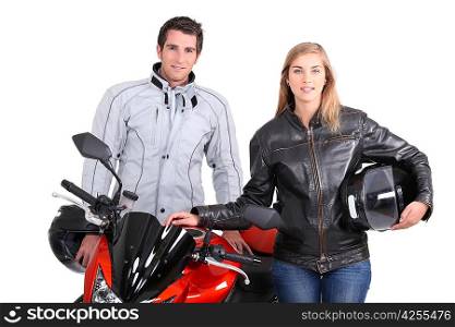 A man, a woman and a motorbike.