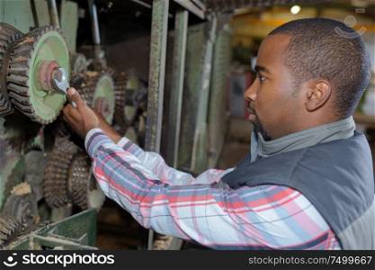 a man adjusting the machine