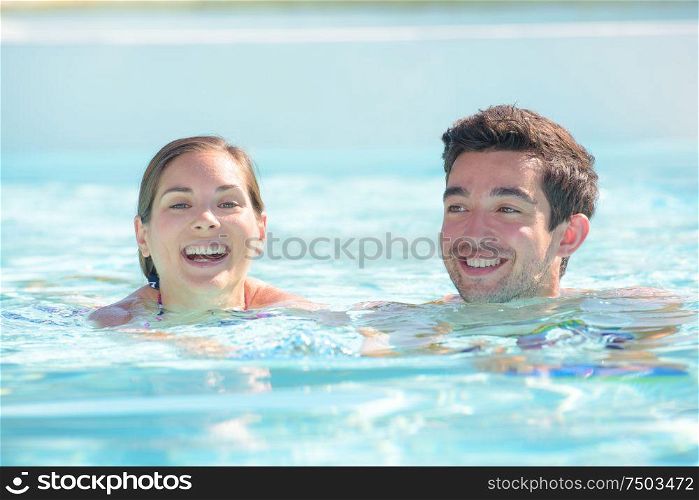 a man and woman swimming