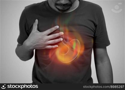 A man burning sensation in the of the middle chest because of acid reflux. Hot in middle chest caused by hyperacidity.