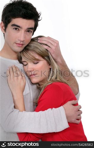 A man comforting his girlfriend.