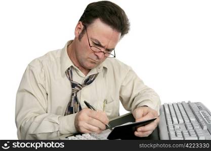 A man concentrating on balancing his checkbook. Isolated on white.