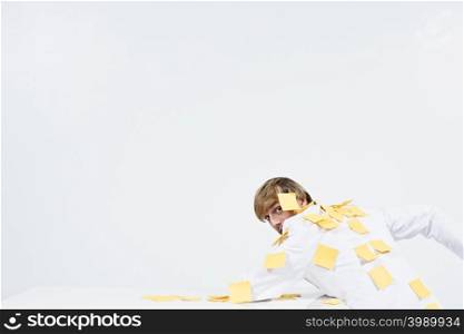 A man covered in adhesive notes