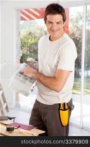 A man doing home improvements in a house