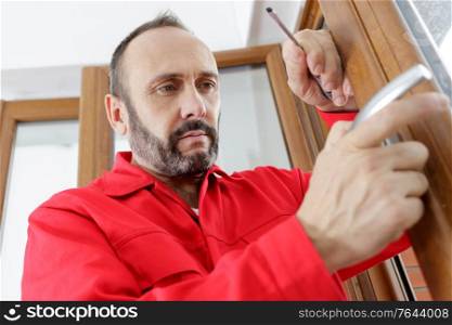a man fixing the door