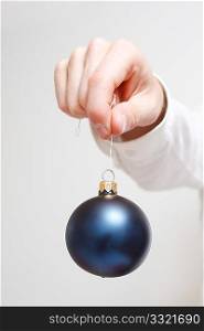 A man holding a christmas ornament