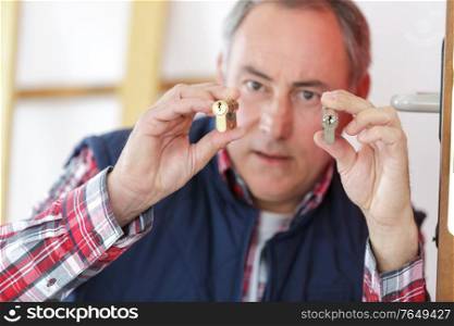 a man holding a padlocks
