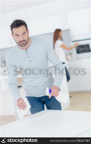 a man is cleaning the house