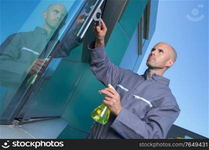 a man is cleaning window
