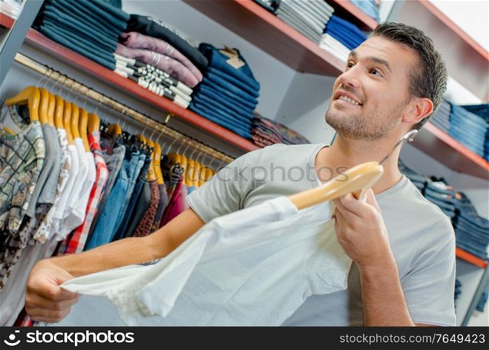 a man is clothes shopping