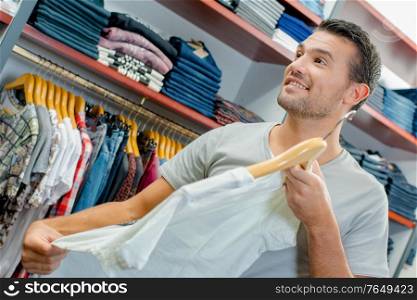 a man is clothes shopping