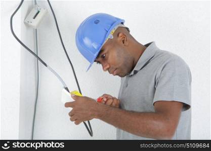 a man is disconnecting the wires