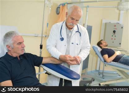 a man is preparing for blood transfusion