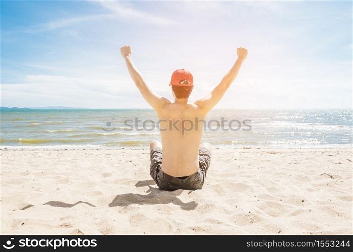 A Man is sitting on beach, summer concept