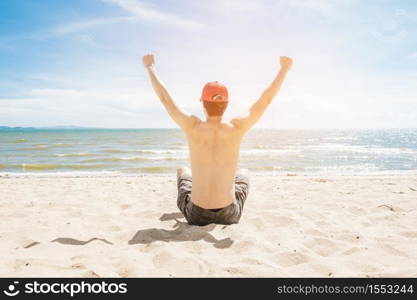 A Man is sitting on beach, summer concept