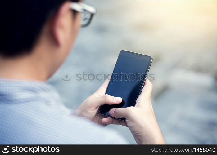 A man is using a mobile phone
