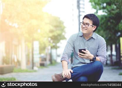 A man is using a mobile phone