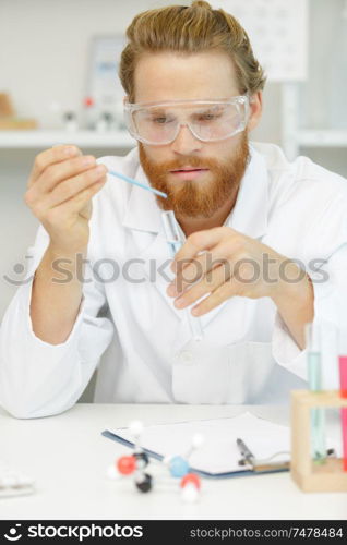 a man is using pipette