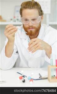a man is using pipette