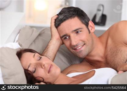a man looking a wife sleeping deeply