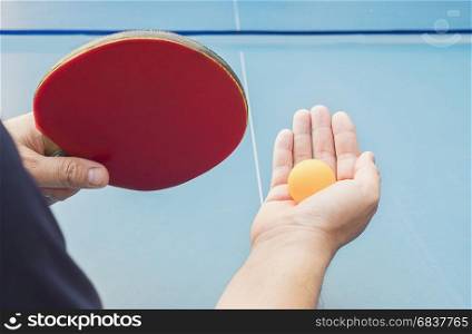 A man play table tennis ready to serve