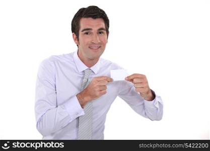 A man presenting his business card.