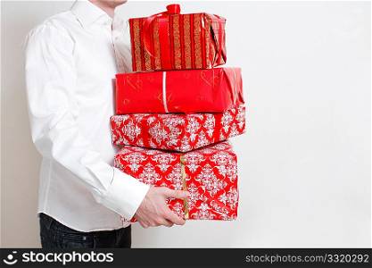 A man presenting several christmas presents