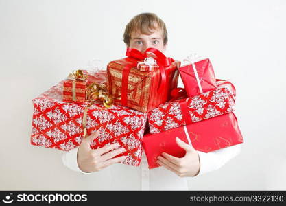 A man presenting several christmas presents