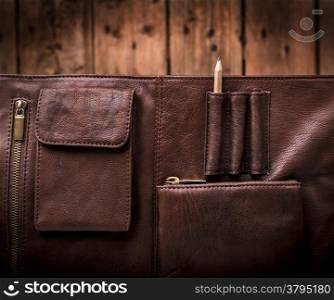 A man&rsquo;s business briefcase bag, leather satchel with a pencil