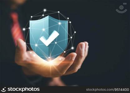 A man safeguards data with shield protect icon, highlighting importance of network security and data protection against cyber threats. Lock symbol signifies secure data. Internet network security