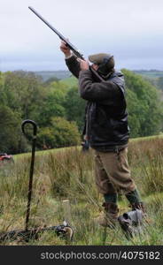 A man shooting a gun