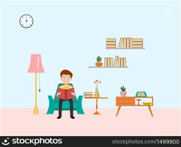 A man sitting reading a book in the living room with blue background