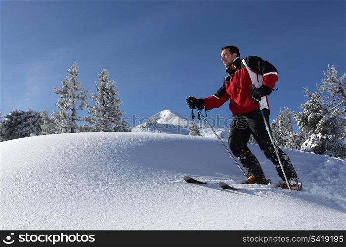 a man skiing in the snowy country