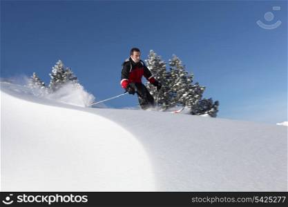 a man skiing in the snowy country