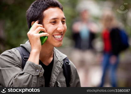 A man talking on a cell phone outdoors