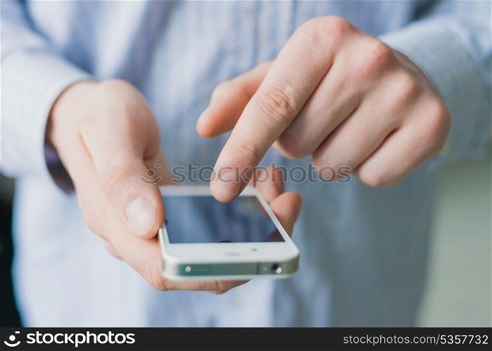 A man uses a smartphone.