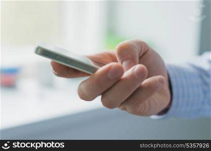 A man uses a smartphone.