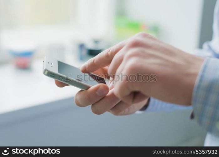 A man uses a smartphone.