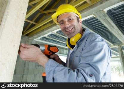 a man using an electric drill
