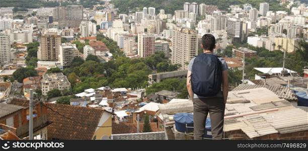 A man walks through the favelas of the city of Rio.