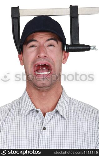 A man with a clamp on his head.