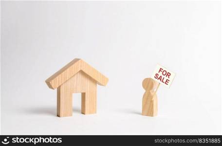 A man with a poster for sale stands near the house. concept of selling a home, buying from the owner. Buying and selling real estate, Realtor Services. Search for housing to purchase