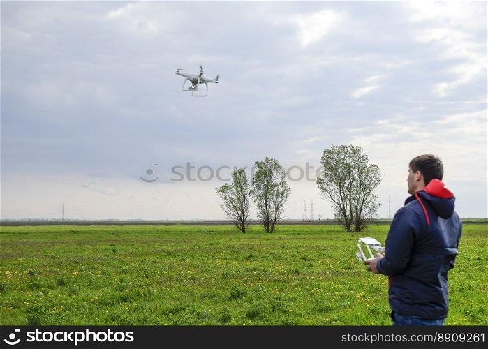 A man with a remote control in his hands. Flight control of the drone. Phantom.. A man with a remote control in his hands. Flight control of the drone. Phantom