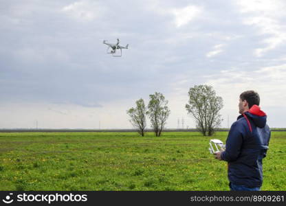 A man with a remote control in his hands. Flight control of the drone. Phantom.. A man with a remote control in his hands. Flight control of the drone. Phantom
