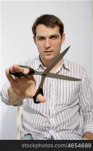 a man with scissors in hand
